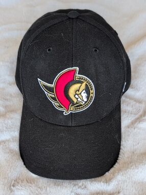 47 Men’s Ottawa Senators Black Cap with Red and Gold Logo